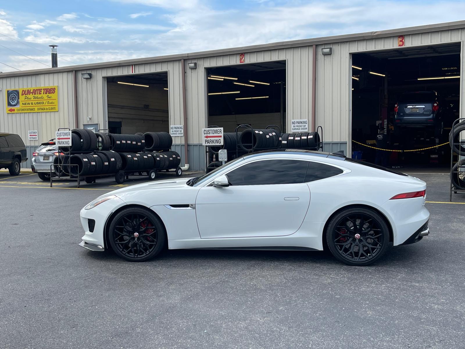 White Jaguar F-Type at Dun-Rite storefront