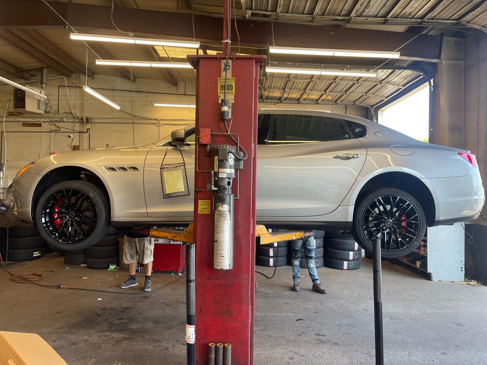 Technician inspecting a vehicle